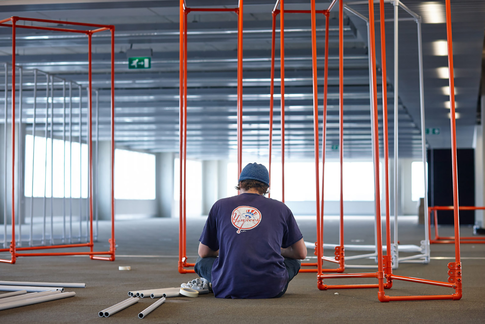 Standard8 team member installing exhibition frame work