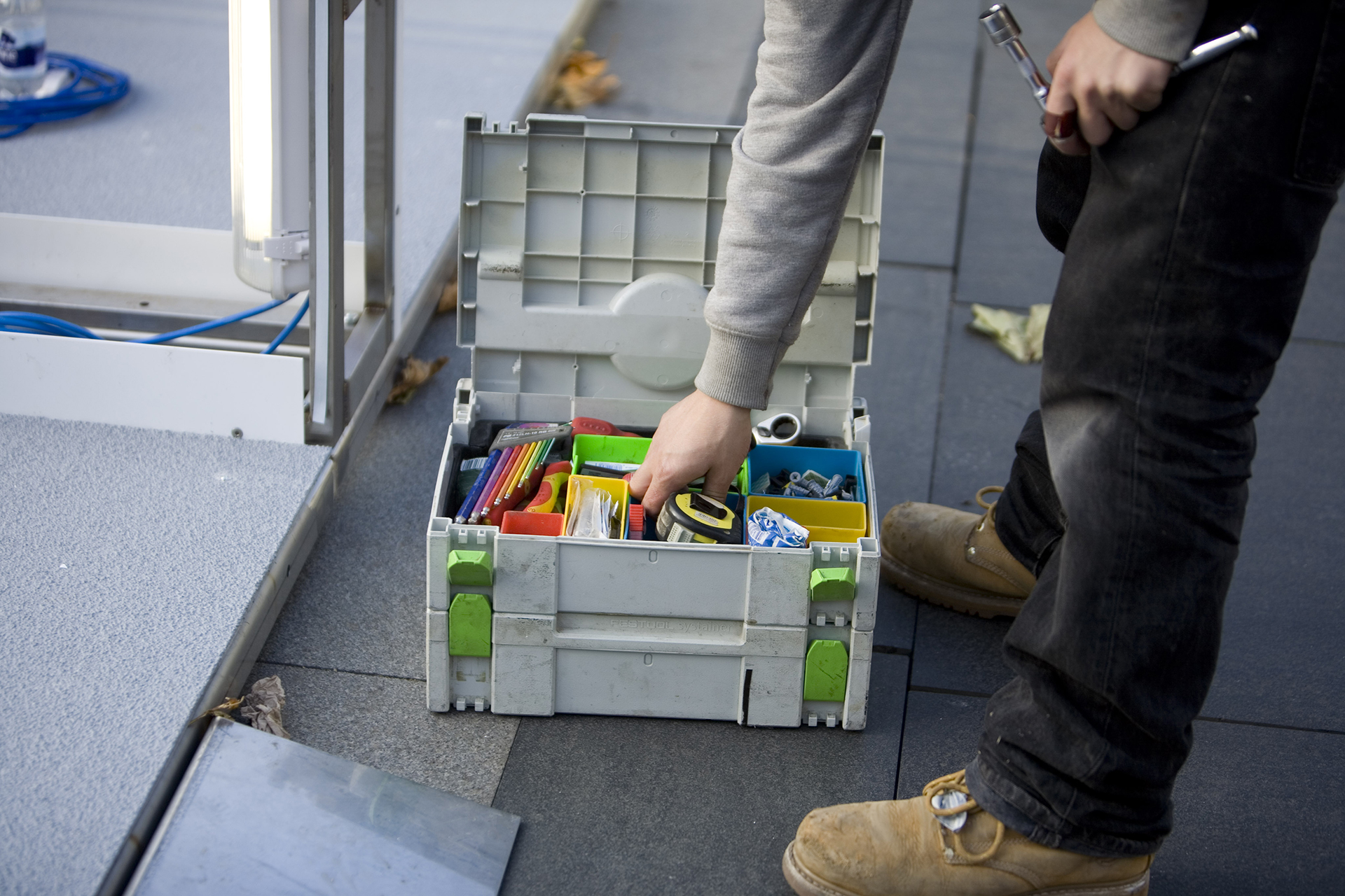 standard8 installation team member on site with tool box